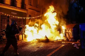 AFP via Getty Images A burning makeshift street barricade in the southern French city of Marseille. Photo: 24 October 2026