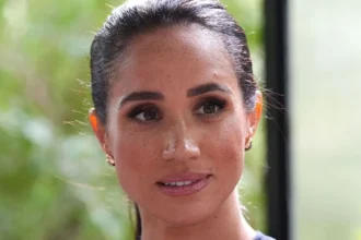 Getty Images Meghan Markle has a ponytail and brunette hair.
