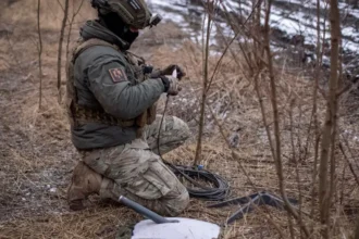 Reuters  A Ukrainian serviceman of 47th brigade prepares a Starlink satellite internet systems at his positions at a front line, in February 2024