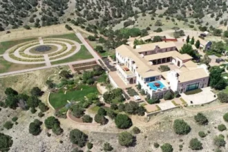 Reuters Epstein's Zorro Ranch in New Mexico seen from the air. It is lavish and surrounded by small bushes
