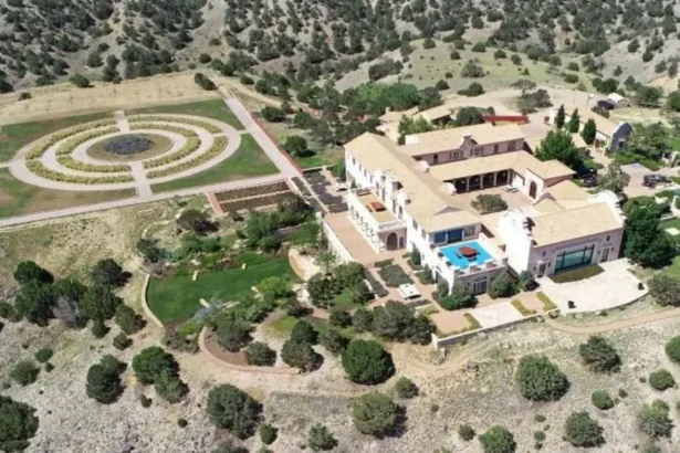 Reuters Epstein's Zorro Ranch in New Mexico seen from the air. It is lavish and surrounded by small bushes