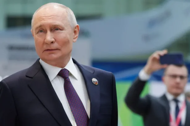 Reuters Russian President Vladimir Putin looking to the side as he stands during a presentation of Russian technology at the Russia-Africa Summit.