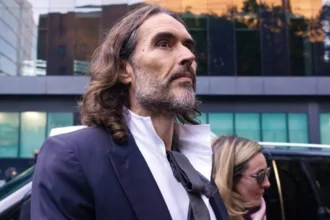 Getty Images Russell Brand and wife Laura Brand arrive at court ahead of his trial, where he faces rape and sexual assault charges at Southwark Crown Court on October 28, 2026 in London, England. Russell Brand has been charged with three counts of rape, three counts of sexual assault and one count of indecent assault. He has denied all charges