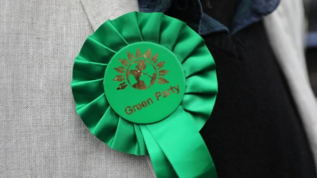 27badc80-d098-11f1-b7fd-31adcdf71225-jpg PA Media Stock image of a Green Party rosette