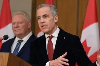AFP via Getty Images Mark Carney, Canada's prime minister, right, and Doug Ford, Ontario's premier, during a news conference in Ottawa, Ontario, Canada, on Thursday, Dec. 18, 2025.