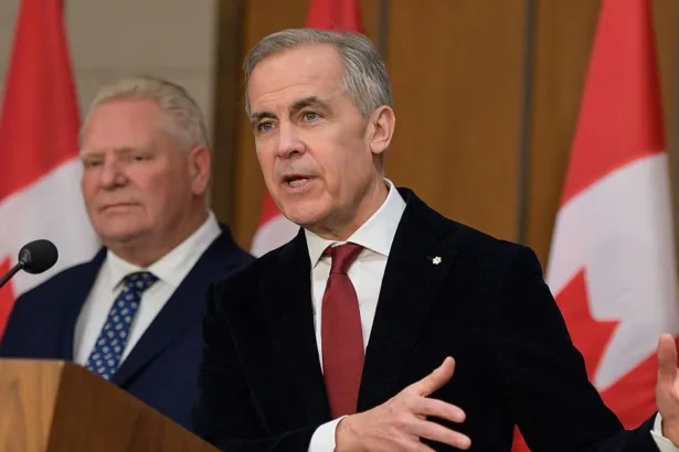 AFP via Getty Images Mark Carney, Canada's prime minister, right, and Doug Ford, Ontario's premier, during a news conference in Ottawa, Ontario, Canada, on Thursday, Dec. 18, 2025.