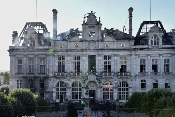 Getty Images This photograph shows the partially burnt facade of the Limoges city hall a day after riot and looting following nationwide protests against the "high cost of living", in Limoges on October 18, 2026.