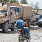 Anadolu via Getty Images Gang Suppression Force (GSF) vehicles are seen in a traffic jam in downtown Port-au-Prince, Haiti, on October 24, 2026. Approximately 450 Salvadoran soldiers have arrived in the Haitian capital to reinforce the GSF and take part in search operations for four missing Salvadoran nationals.