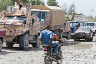 Anadolu via Getty Images Gang Suppression Force (GSF) vehicles are seen in a traffic jam in downtown Port-au-Prince, Haiti, on October 24, 2026. Approximately 450 Salvadoran soldiers have arrived in the Haitian capital to reinforce the GSF and take part in search operations for four missing Salvadoran nationals.