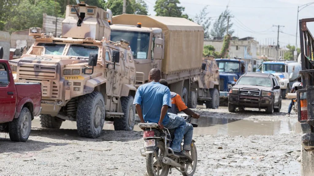 2e1cb430-d355-11f1-a772-cb496d11fa15-jpg Anadolu via Getty Images Gang Suppression Force (GSF) vehicles are seen in a traffic jam in downtown Port-au-Prince, Haiti, on October 24, 2026. Approximately 450 Salvadoran soldiers have arrived in the Haitian capital to reinforce the GSF and take part in search operations for four missing Salvadoran nationals.
