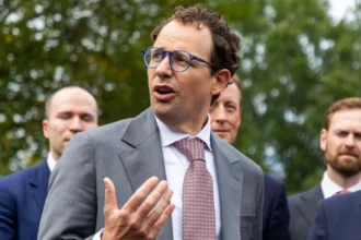EPA Anthropic CEO Dario Amodei gestures with his hands while speaking to reporters outside of the White House.