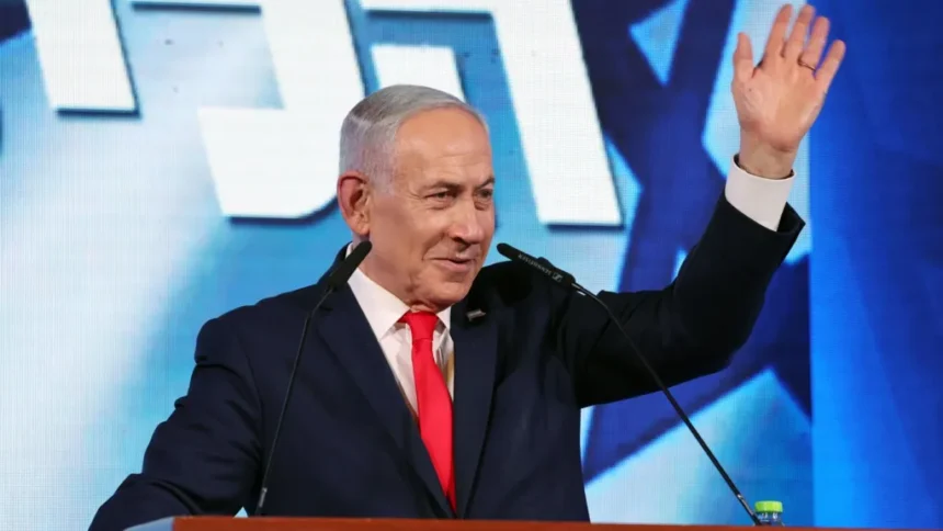 EPA Israeli Prime Minister Benjamin Netanyahu waves while addressing supporters at his Likud party's headquarters in Jerusalem (28 October 2026)