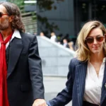 Reuters Russell Brand and Laura Brand holding hands and walking into court on Thursday