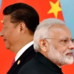 AFP via Getty Images Chinese President Xi Jinping (L) and Indian Prime Minister Narendra Modi attend the group photo session during the BRICS Summit at the Xiamen International Conference and Exhibition Center in Xiamen, southeastern China's Fujian Province on September 4, 2017.