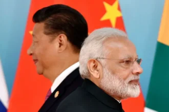 AFP via Getty Images Chinese President Xi Jinping (L) and Indian Prime Minister Narendra Modi attend the group photo session during the BRICS Summit at the Xiamen International Conference and Exhibition Center in Xiamen, southeastern China's Fujian Province on September 4, 2017.