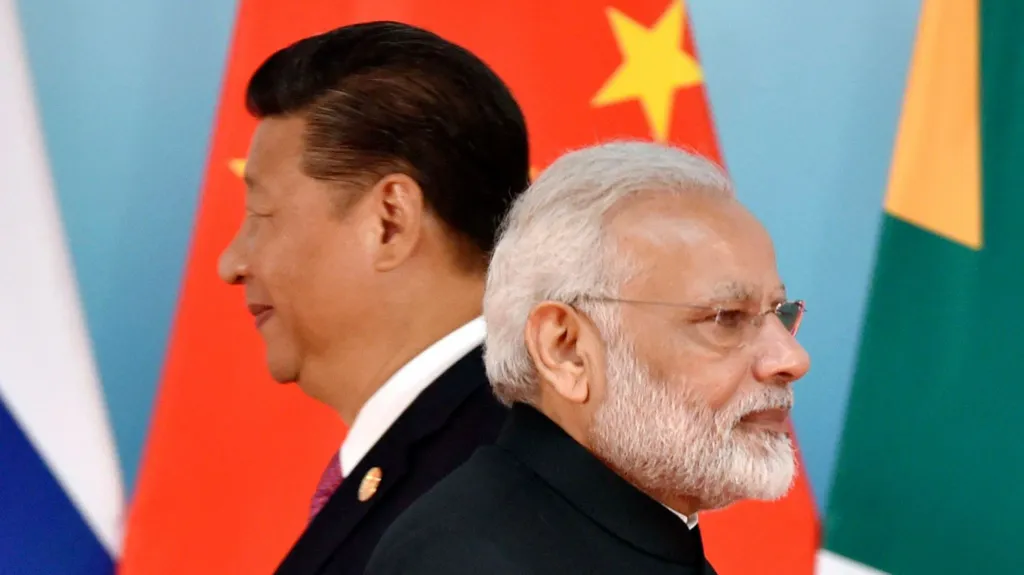 AFP via Getty Images Chinese President Xi Jinping (L) and Indian Prime Minister Narendra Modi attend the group photo session during the BRICS Summit at the Xiamen International Conference and Exhibition Center in Xiamen, southeastern China's Fujian Province on September 4, 2017.