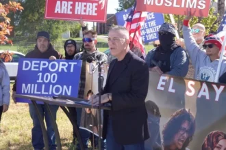 Image shows Greg Bovino at a rally