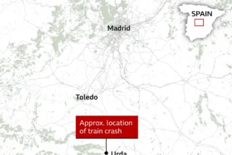 Map of central Spain showing Madrid and Toledo. A black dot and red label marks the "approximate location of train crash" near the town of Urda, south-east of Toledo. An inset map of Spain highlights the area in the centre of the country.