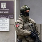 Andrej ISAKOVIC / AFP via Getty Images A member of Serbia's Gendarmerie stands guard at the entrance to the Israeli embassy in Belgrade on October 28, 2026.