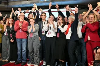 AFP via Getty Images Members of the Student List celebrate victory in Serbia's parliamentary election