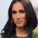 PA Head and shoulders of Meghan, Duchess of Sussex, wearing a green sleeveless top.