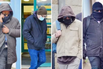Press Association A composite image of the four defendants arriving at court. They are all wearing a hat or a hood, covering their face and eyes with glasses.