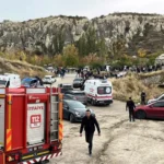 Reuters Fire truck and ambulances are parked near the scene