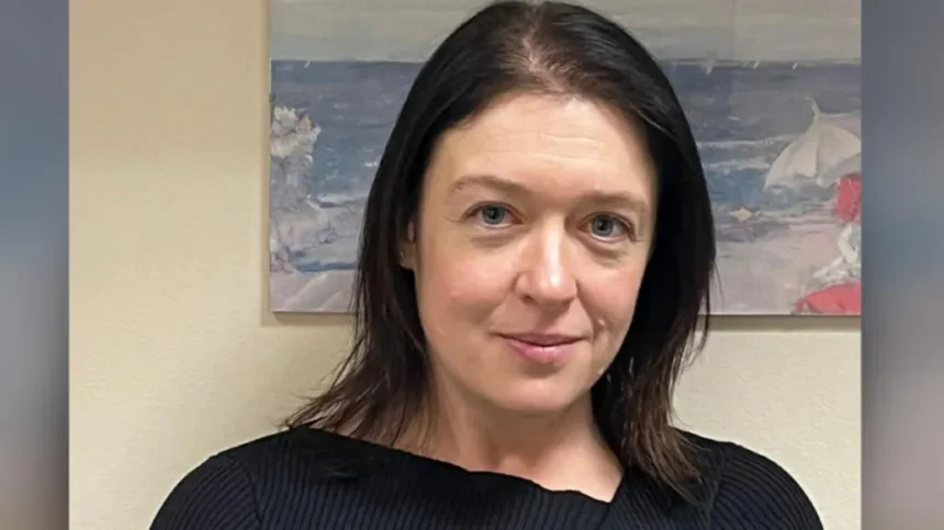 Wiltshire Police/PA Media Head and shoulders image of Joanne Young in a black top. She has black hair and is smiling. She is standing in a room in front of a painting.