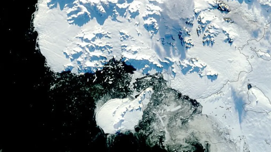 MODIS Satellite image of Antarctica. To the left of the image is the ocean, which is black. A small white landmass, which is Rothschild Island, is at the centre bottom of the image. There is a large landmass to the right of the image, which is Alexander Island. The Amos Channel is a stretch of water between the northern tip of Rothschild Island and Alexander Island. The water of the Channel is black with broken ice in it.