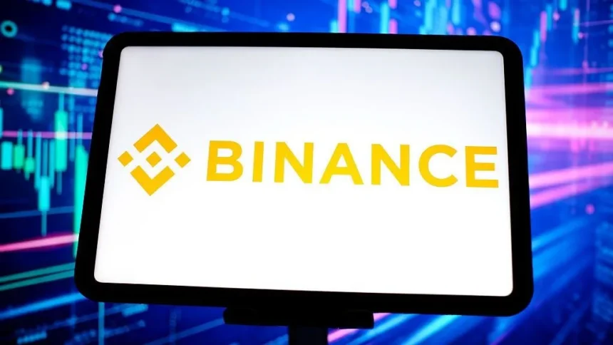 Getty Images A tablet with a white background and the yellow Binance logo on it against a blue background