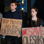 Getty Images Activists hold placards with slogans during a rally in support of residents of Oleshky, Kherson region, calling on the international community to draw attention to the humanitarian situation in the Russian-occupied city.