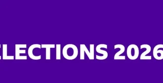 Purple banner reading "US Midterm Elections 2026" alongside a stylised image of the US Capitol and white stars.