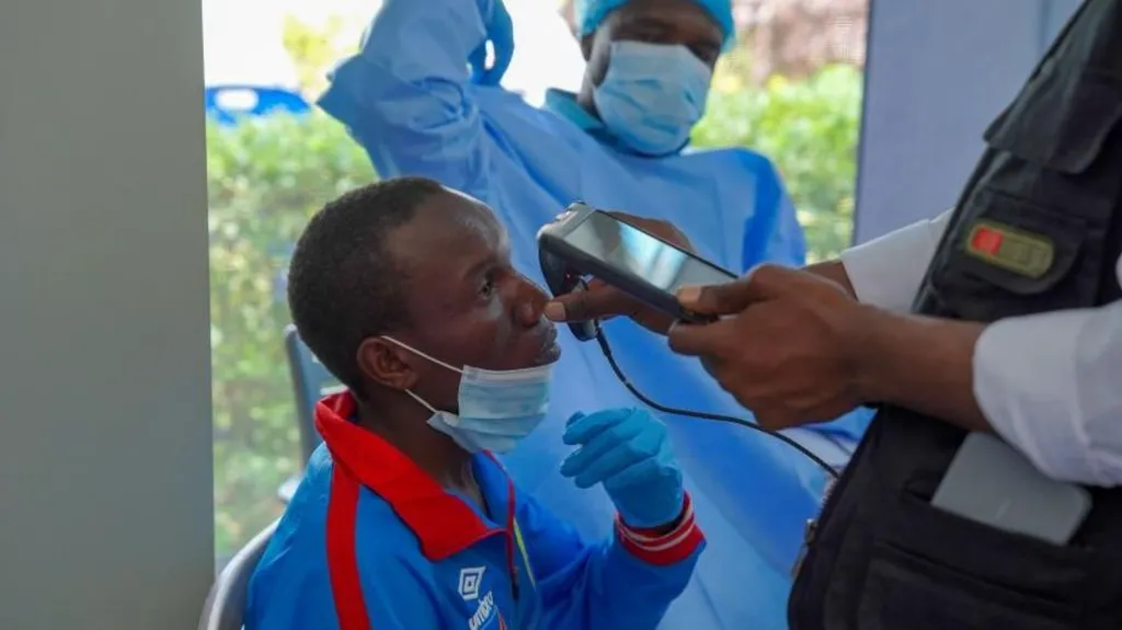 dc9ee270-d531-11f1-866a-b522399149a0-jpg EPA/Shutterstock A man getting checked by a health professional who holds an implement up to him