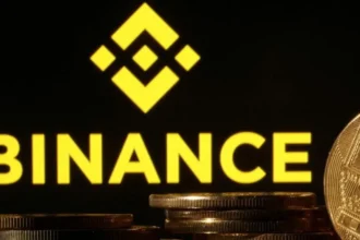 Reuters Binance logo is seen together with representations of cryptocurrencies. File photo