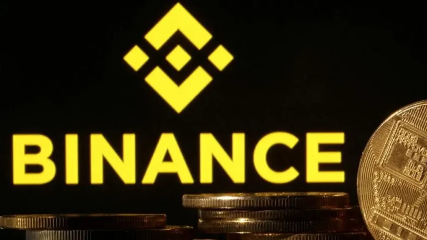 Reuters Binance logo is seen together with representations of cryptocurrencies. File photo