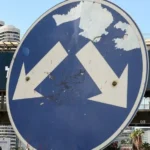 AFP via Getty Images A street sign points at billboards for Eisenkot and Netanyahu.