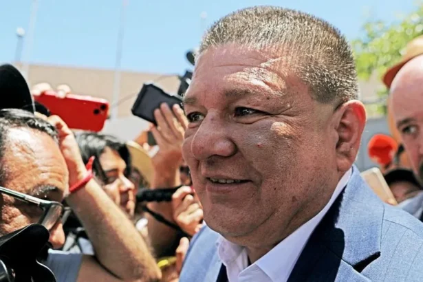 Getty Images Former Chihuahua Prosecutor Cesar Jauregui, who has short brown hair and wears a suit, is pictured during a rally in support of the Governor of Chihuahua, Maru Campos, outside the Attorney General's Office (FGR) in Ciudad Juarez, Chihuahua, Mexico, in May