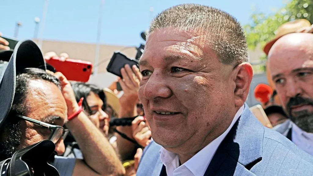Getty Images Former Chihuahua Prosecutor Cesar Jauregui, who has short brown hair and wears a suit, is pictured during a rally in support of the Governor of Chihuahua, Maru Campos, outside the Attorney General's Office (FGR) in Ciudad Juarez, Chihuahua, Mexico, in May