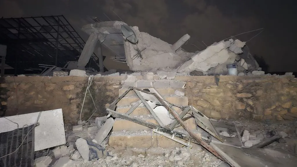 f7a08cb0-d1a1-11f1-9ca8-7ff2fe25f975-jpg Anadolu via Getty Images Rubble sits atop a small brick wall and six stairs.