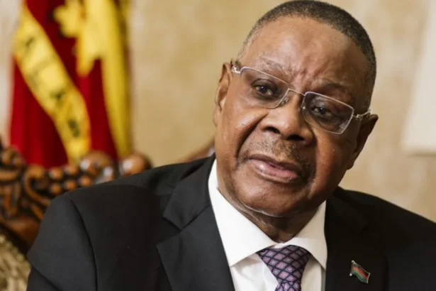 Bloomberg via Getty Images Peter Mutharika wearing a black suit and dotted tie speaks during an interview in Lilongwe, Malawi
