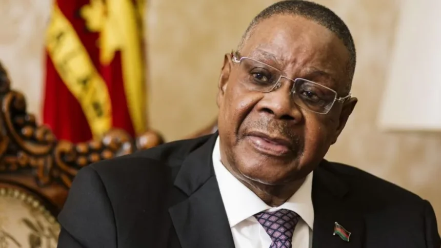 Bloomberg via Getty Images Peter Mutharika wearing a black suit and dotted tie speaks during an interview in Lilongwe, Malawi